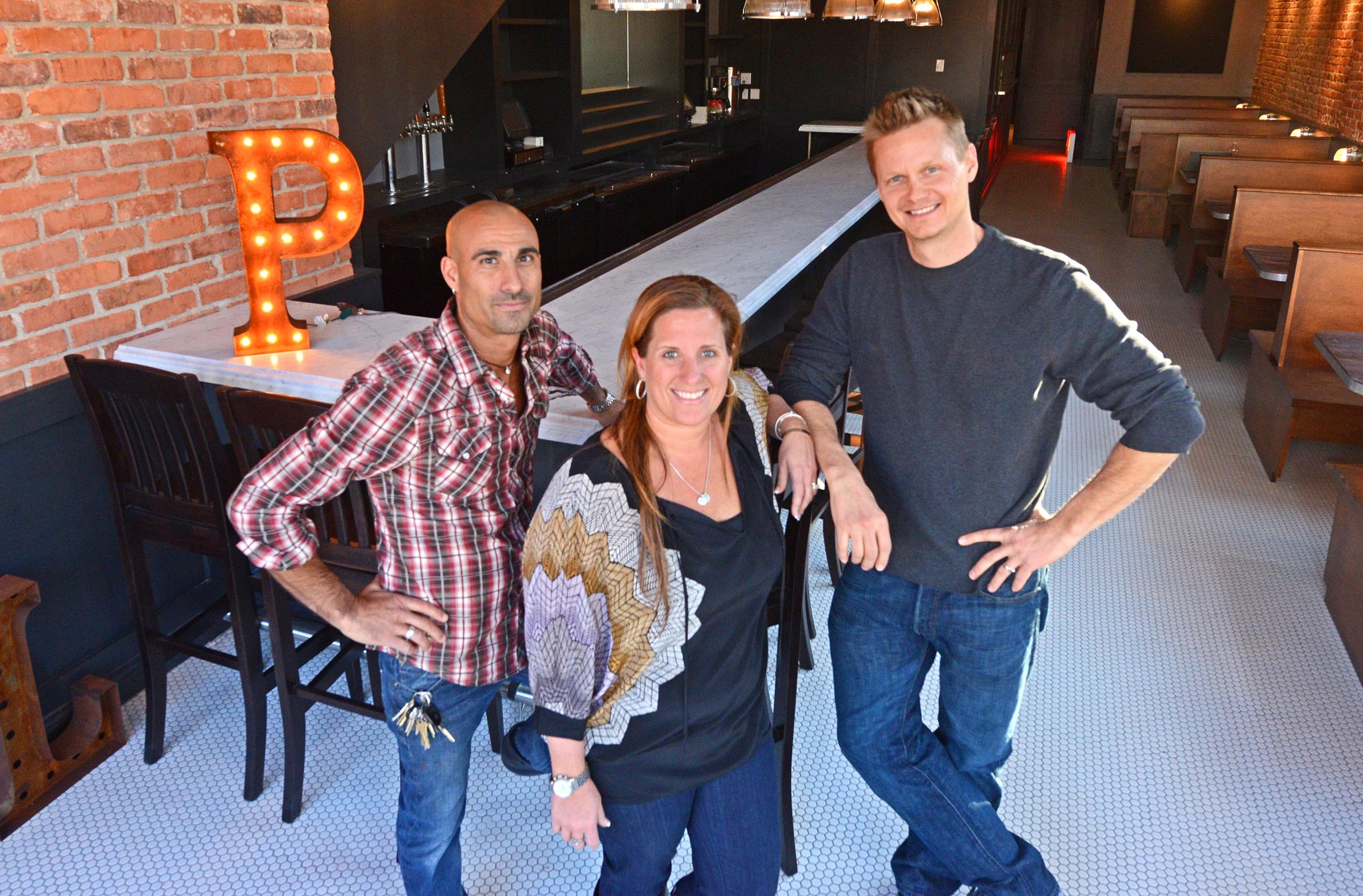 Jared Golden, Michelle Williams and Ted Wallof are finishing a redesign of DeLux in the Fan, turning it into Pearl Raw Bar, which they hope to open this month. - SCOTT ELMQUIST