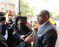 Mayor Dwight Jones talks to reporters outside of the Empire Theatre, now the Sara Belle and Neil November Theatre, in early November.