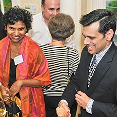 Monica and Michael Rao greet university alumni.