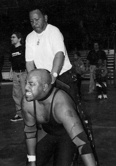 P.T. Brown chokes an opponent in October 2005. - P.T. BROWN