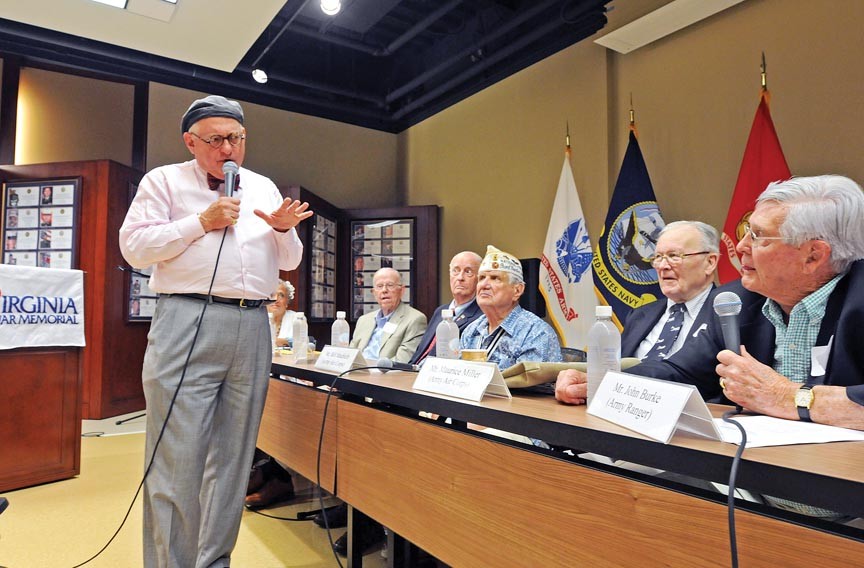 Tony Booth is the emcee for a panel discussion with World War II veterans at the Virginia War Memorial. He has done other presentations at the venue on radio and war.