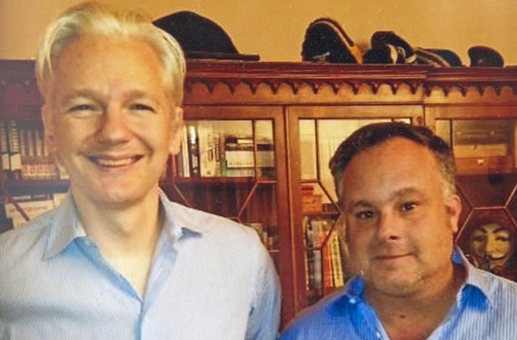WikiLeaks editor-in-chief, Julian Assange  appears with Trevor FitzGibbon in a photo. Assange is receiving political asylum at the Ecuadorian Embassy in London and fears if he leaves he will be arrested and extradited to the United States.
