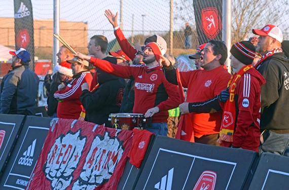 The Kickers’ rowdy fan group, the Red Army, cheers and jeers at a pre-season scrimmage at Ukrop Park. At City Stadium its members sit in Section O and can be heard chanting and drumming throughout games. The occasional smoke bomb is set off. - SCOTT ELMQUIST