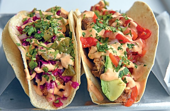 With fillings like chicken-fried carne asada, at left, and cornmeal-crusted catfish, Soul Taco serves classics with a twist. - SCOTT ELMQUIST/FILE