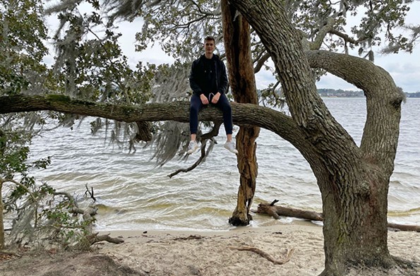 Kulusic is out on a limb at First Landing State Park. - PHOTO COURTESY DOMINIK KULUSIC