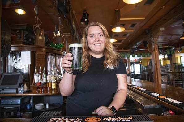 Bartender Brittany Forte holding a Snakebite at Siné’s Irish Pub. 1327 E. Cary St. - SCOTT ELMQUIST