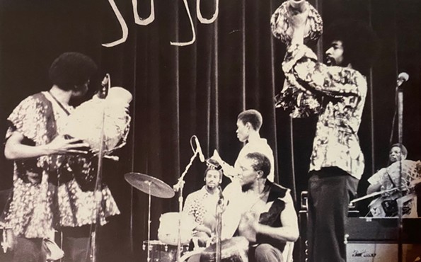 Plunky Branch performs on shekere (left) while Ndikho Xaba plays conga drum during a concert at Howard University in Washington, DC. circa 1975. - FROM THE REISSUE ALBUM