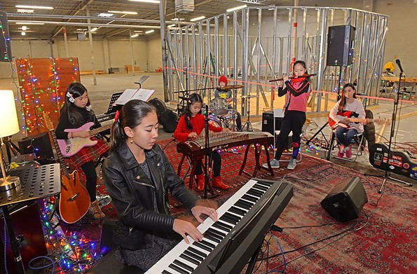 [From 2018 file photo] Red Flag, a group of middle school girls who play rock in mandarin Chinese, practice at Orbital Music Park, a space that has been described as “eHarmony for guitars.” - SCOTT ELMQUIST