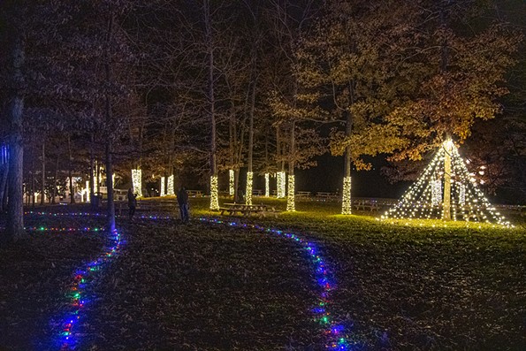 Through Jan. 8, 2023, "guests of Veritas Illuminated have the chance to meander through a 0.3-mile walking trail trimmed with holiday lights and paired with Christmas music." - SCOTT ELMQUIST