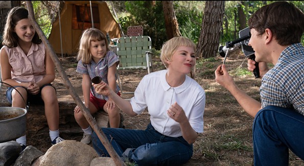 Michelle Williams mugs for the camera and Gabriel LaBelle in "The Fabelmans." - UNIVERSAL STUDIOS AND AMBLIN ENTERTAINMENT