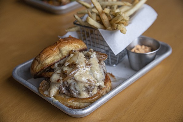 The French Onion burger ($15) includes gruyere, caramelized onion, and french onion sauce. - SCOTT ELMQUIST
