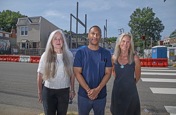 Public Art Commission Secretary Susan Glasser, artist Sylvio Lynch, and PAC chair Ashley Kistler stand in front of the - construction for Fire Station #12. - Lynch, the only Richmond artist on the four-artist team for that installation, will be making a presentation about the work on Sept. 21 (6 p.m.) during a district meeting at Byrd Park Round House hosted by Councilwoman Stephanie Lynch. - SCOTT ELMQUIST
