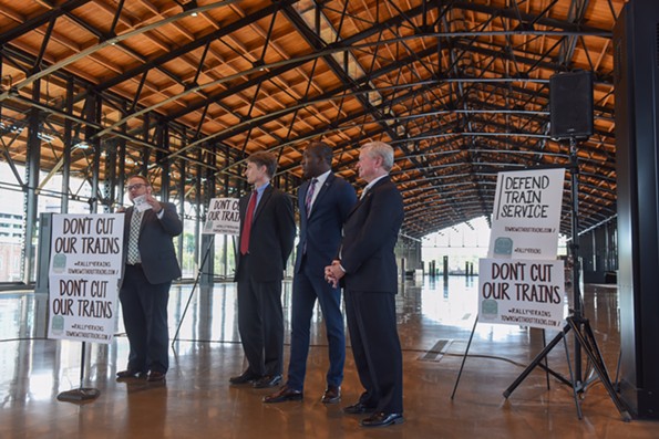 Danny Plaugher of Virginians for High Speed Rail leads a rally for trains and transit funding. With him are Trip Pollard of Southern Environmental Law Center, Mayor Levar Stoney and Jack Berry of Richmond Region Tourism. - SCOTT ELMQUIST