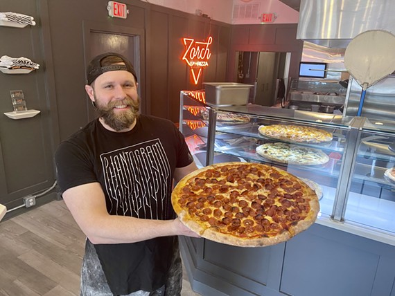 Rob Zorch holds an ever-popular pepperoni pie at Zorch in Carytown.