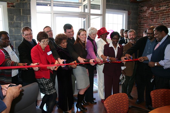 An image of the ribbon-cutting event at Storefront for Community Design, which for ten years has made design programs and resources accessible to all.