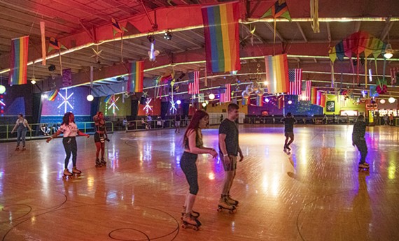 Pride flags hang above the rink floor at Rollerdome. Virginia Pride is sponsoring a Rainbow Roll skate night with drag queens and a costume contest this Sunday, May 15. Moving forward, it will be held the third Sunday of every month.