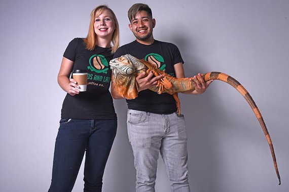 Sarah Tiller and Marcos Garcia hold Ozwald, a three-year-old red iguana and one of the many reptiles they hope at feature at Lizards and Lattes.