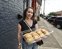 Talented baker Ingrid Schatz stands on Summit Ave in Scott’s Addition outside Afterglow Coffee.