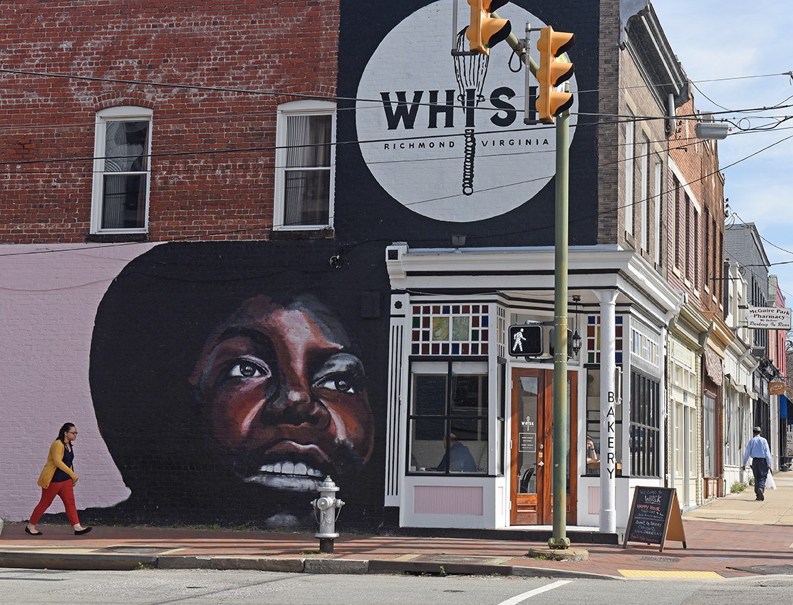The famous Nina Simone mural, updated, on the side of Whisk Bakery.