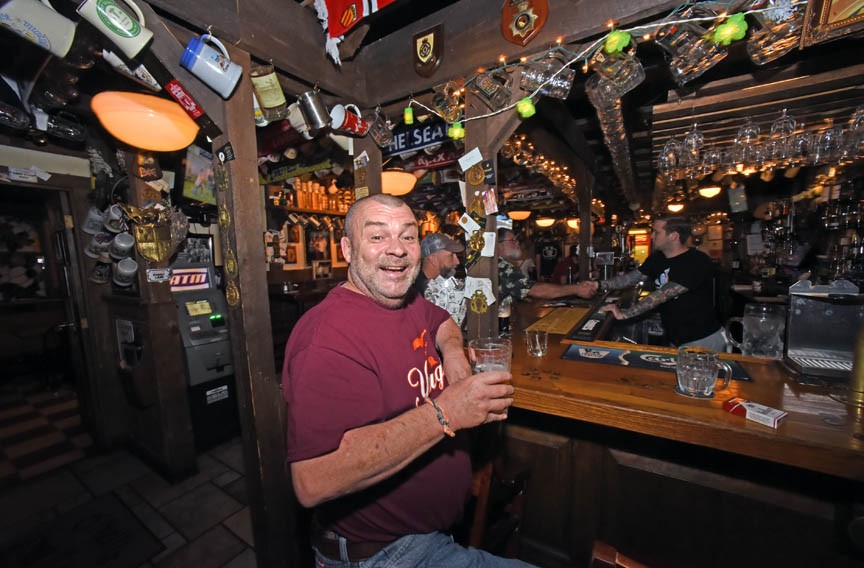 Penny Lane Pub is an oasis of Britain for expats such as Paul Marsh, as well as other dedicated soccer fans. - SCOTT ELMQUIST