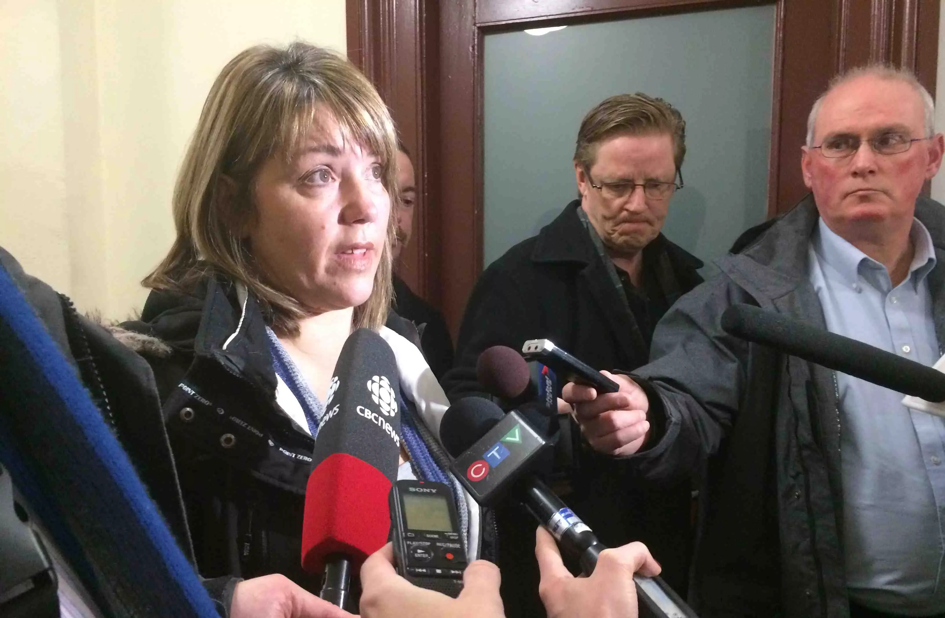 Leah Parsons speaks with reporters yesterday at court.