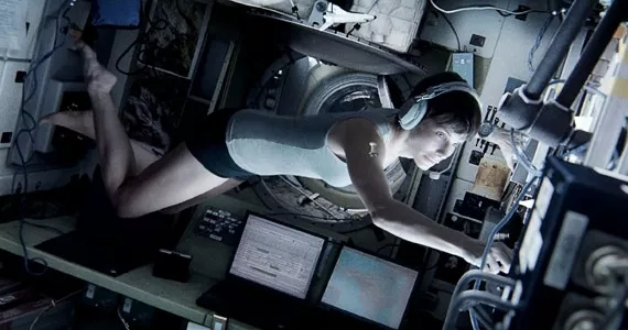 Sandra Bullock in Gravity, having a space ball.