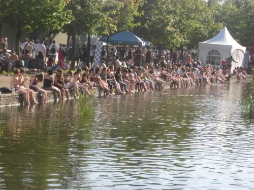 Some tired festival goers cool off in what little ways they can..