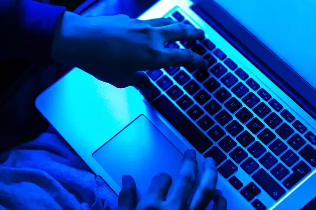 Requisite creepy laptop guy with moody lighting. - VIA ISTOCK, PROBABLY
