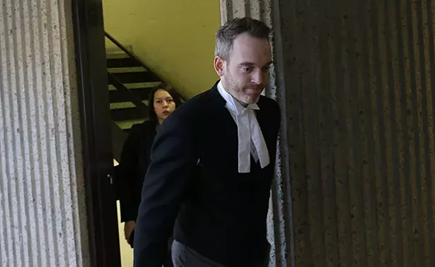 Riley's attorney, Trevor McGuigan, entering court. - KIERAN LEAVITT