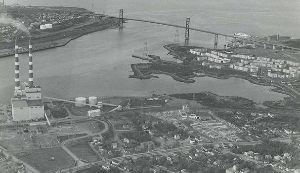 Tuft's Cove, Shannon Park and MacKay Bridge, circa 1973. The peninsula jutting out to the left of the military housing will be soon transferred to the Millbrook First Nation. - HALIFAX MUNICIPAL ARCHIVES
