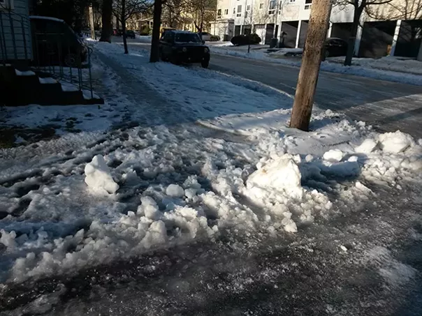 Just one of the messy sidewalks residents had to weather in early January. - VIA @ORIDUINKER ON TWITTER