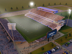 Look at all those fans: Beer-drinking, fry-scarfing, car-driving football enthusiasts. - ARCHITECTURE49