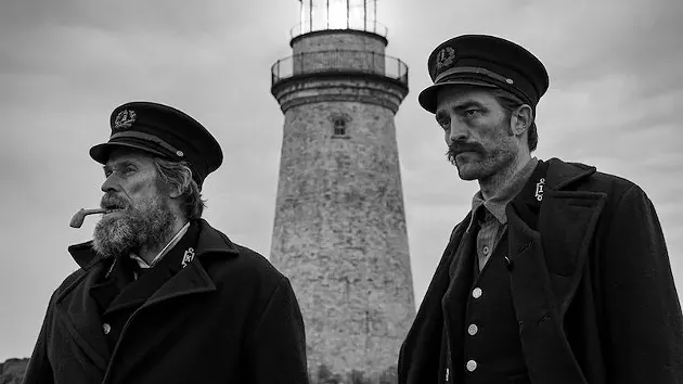 Willem Dafoe and Robert Pattinson stare into the abyss in The Lighthouse. - FILM STILL VIA FINFESTIVAL.COM