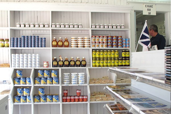 Stark white shelves line the walls inside the Newfoundland Store; they’ve carried essential household staples for over 50 years. - SHELAGH DUFFETT