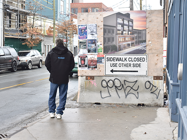 Construction sites that interfere with sidewalks, like those along Gottingen Street, are now legally required to create barriers with the "F-type" concrete chunks like the one here on Gottingen Street. - THE COAST