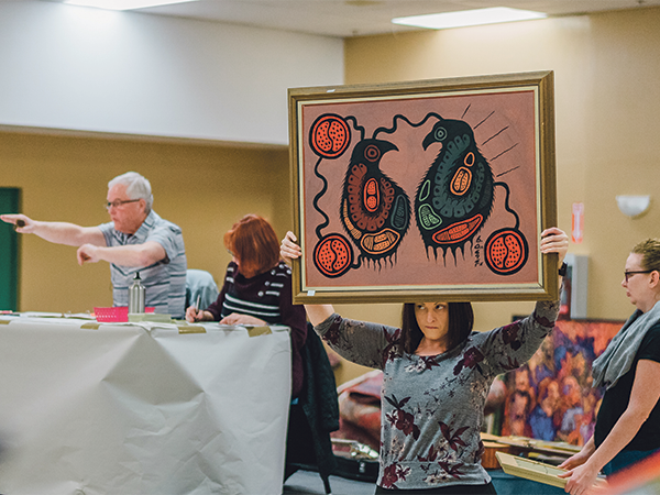 There’s a lot to see at an auction, like the one above at the Halifax Forum, so Melanie Mather of Lo + Behold says it’s important to stay focused. - IAN SELIG