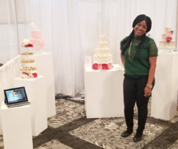 Temi Ologbenla shows off her cakes at a wedding expo. - INSTAGRAM