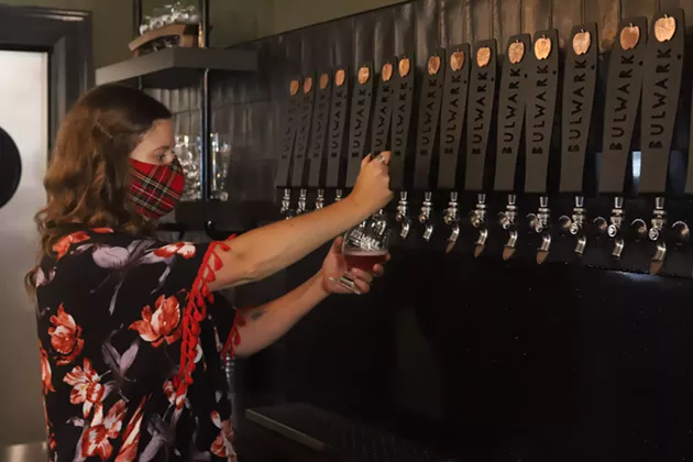 Cider House manager Shauna Krasuski pours a Bulwark Blush. - VICTORIA WALTON