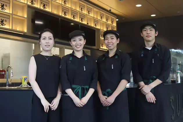 Yichun Li (left) and her team at the new Halifax location. - VICTORIA WALTON