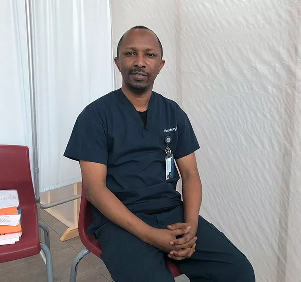 On breaks in his 12-hour testing clinic shift, Janvier Korongo can take off his mask and gloves. - SUBMITTED