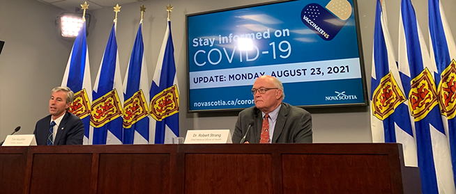 Houstrang—premier Houston and top doc Strang—last week at their first COVID briefing together. - THE COAST