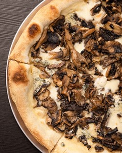 A Lou Pécou pizza, topped with mushrooms, white sauce and authentic Italian truffle oil. - SUBMITTED