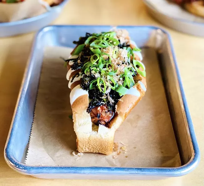 Side Hustle did a dashi dog for Burger Bash one year, loading on dashi aioli, katsu BBQ sauce, nori, bonito and green onions for the wiener win. - SUBMITTED