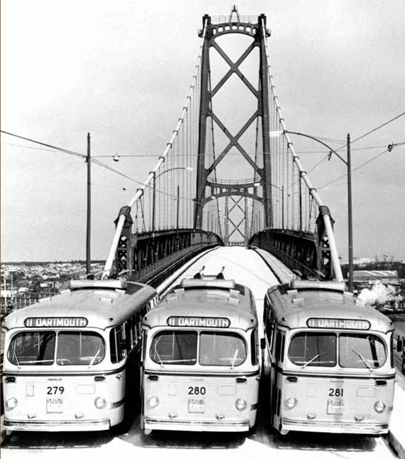 Nova Scotia Light and Power Company’s trolley buses provided the first public transportation across the harbour span. - HALIFAX HARBOUR BRIDGES
