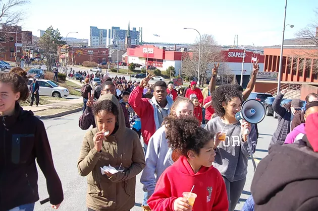 The crowd makes its way downtown. Drinks and snacks for the youth marchers were handed out by EDNA on Gottingen Street. - THE COAST