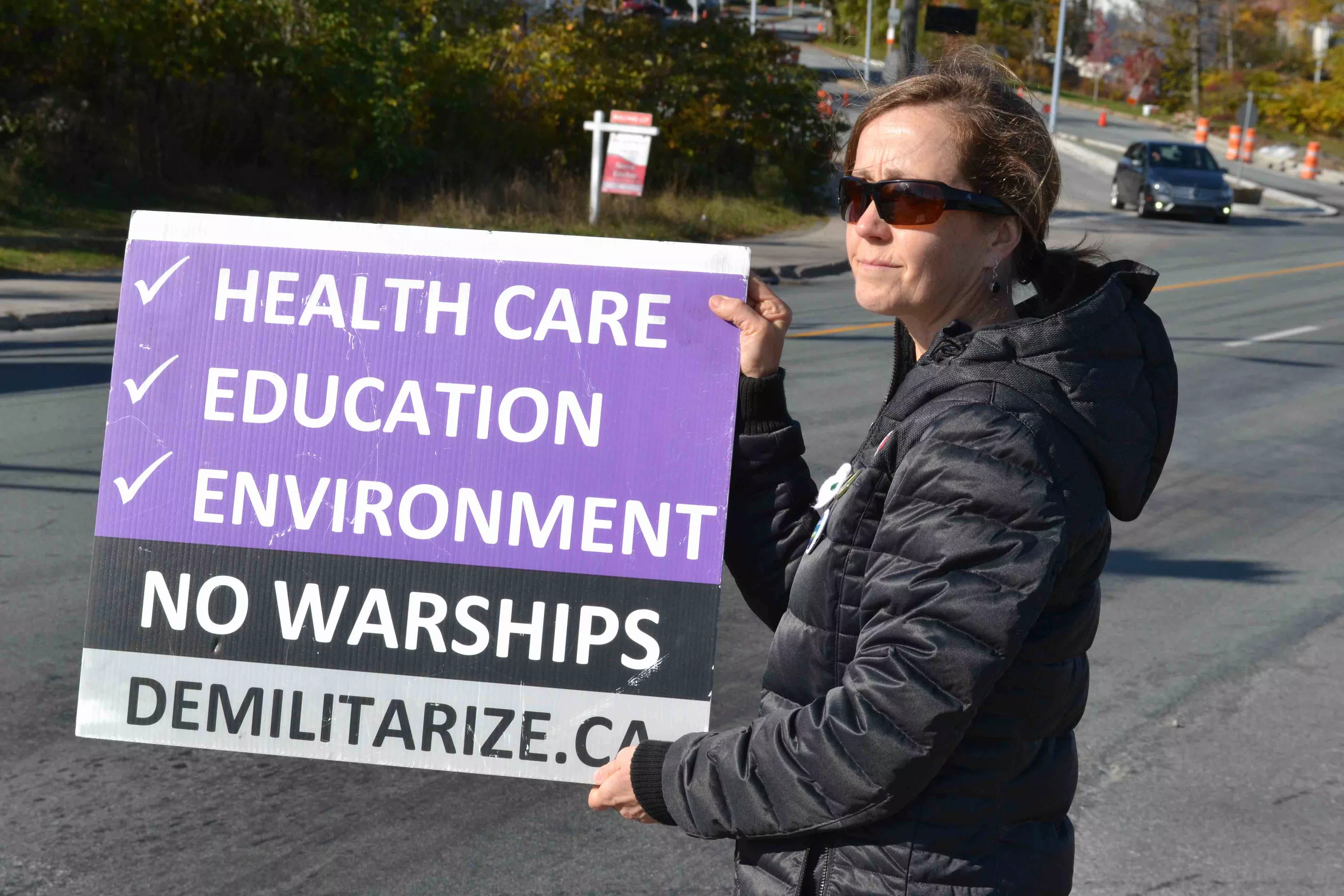 Tamara Lorincz, back in town and protesting outside the Irving Shipyard on Barrington Street on November 2. - THE COAST