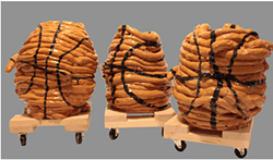 Ceramic basketballs by Lucy Marrion Pauker at the Laundry Room Gallery (see 6). - SUBMITTED