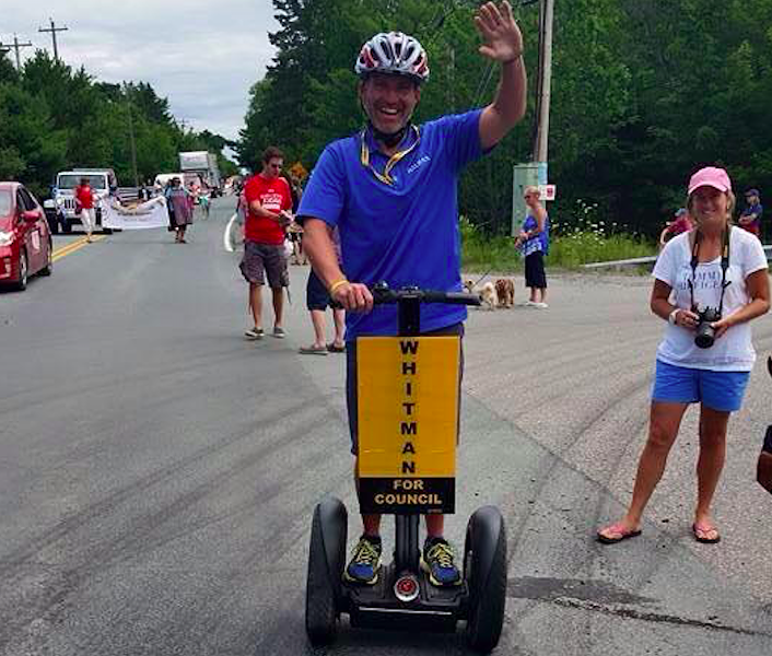 Whitman, pictured in one of many social media posts riding a Segway. - VIA FACEBOOK