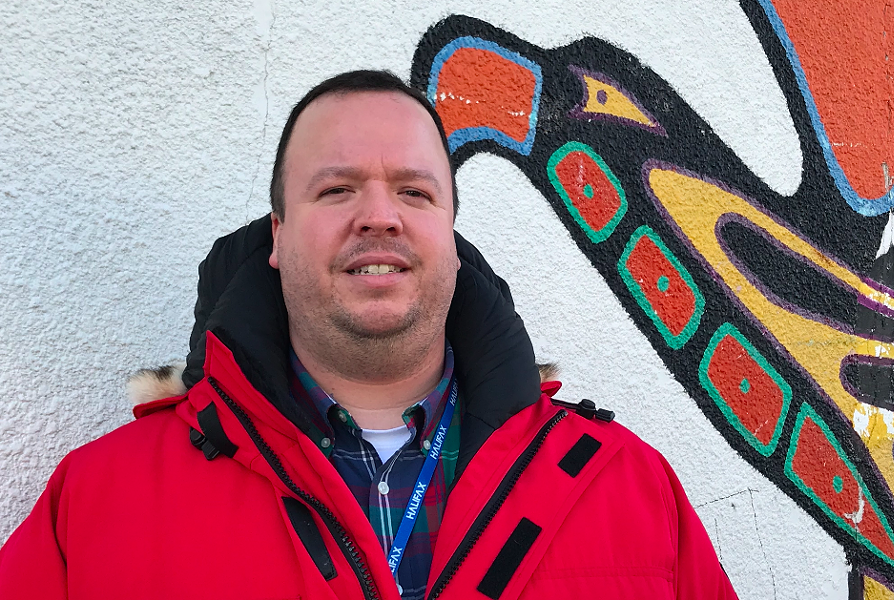 Halifax's new Indigenous advisor Wyatt White stands in front of the Mi'kmaw Native Friendship Centre on Gottingen Street. - THE COAST