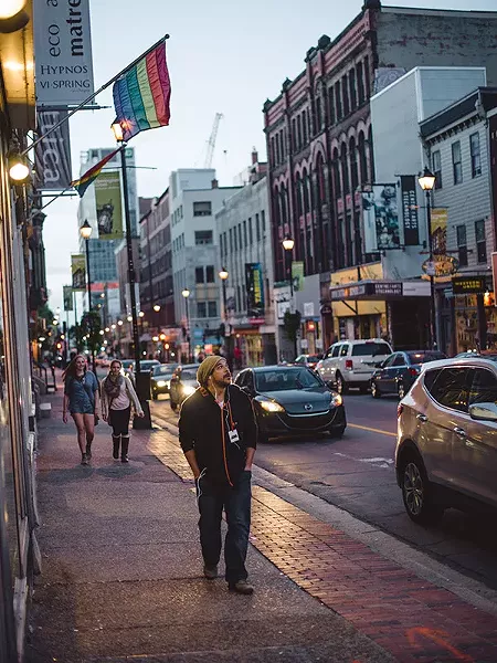 Halifax, Nova Scotia, 2014 Cory, an audience participant walks city streets listening to an audio guide. - MEL HATTIE